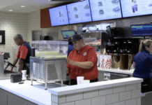 Staff at Chick-fil-a working on several orders.
