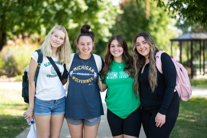 A group of freshman friends gather in the quad during common hour. Most freshman and transfers moved into their dorms on August 22.